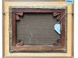 an old picture frame with a heart hanging from it ' s side