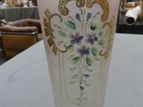 two vases sitting on a table in a room