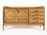 an image of a wooden cabinet with four drawers and two doors