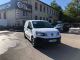 a white van that is parked in front of a building