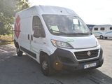 a white van that is parked in a parking lot