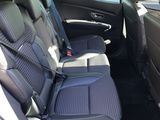 the back seats of a car are black and grey in color