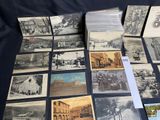 a lot of old photos on the table