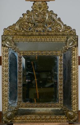 a mirror that is sitting on a table in a room