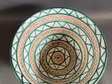 a bowl that has a design on the inside of it