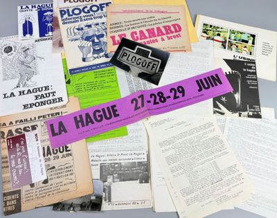 a pile of papers and pamphlets on a table
