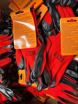 a pile of gloves with tags on them in a store