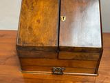 a small wooden box sitting on a wooden table