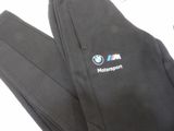 the pants are black and have a bmw logo on them
