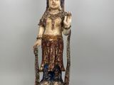 an image of a statue of a woman holding a sword