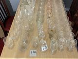 a lot of empty wine glasses on the table