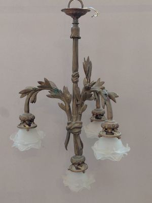 a small chandelier with three lights hanging from it