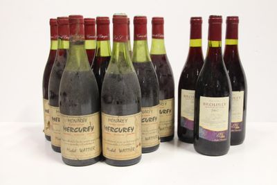 six bottles of wine are lined up in a row on a white surface