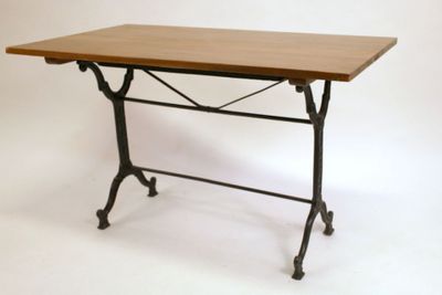 a table that has a wooden top and metal legs
