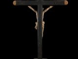 a black cross with a wooden crucift on top of it