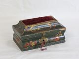 a small wooden box with a red velvet lining