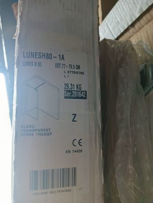packaging of a box with a label on it sitting on top of a cardboard box