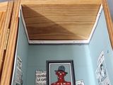 a picture of a picture of a red man in a room