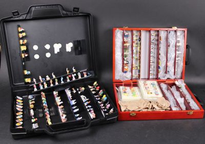 two suitcases that have various items in them