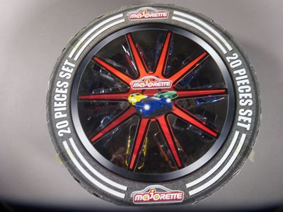 a close up of a toy car wheel on a table
