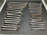 a lot of wrenches that are on the table