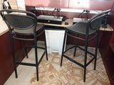 two chairs that are next to each other in a kitchen