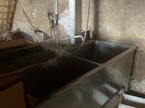 an image of a kitchen with a sink and a ladder