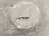 a picture of a white object wrapped in plastic on a table