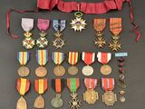 an assortment of medals and medals are displayed on a table