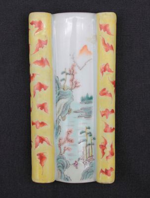 a vase with a painting on it on a black surface