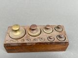 a small wooden box with buttons and knobs on it