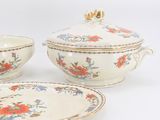 three pieces of china on a white table