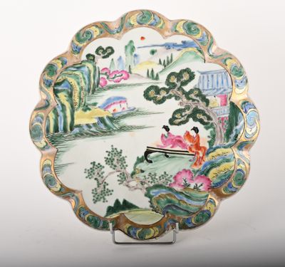 a plate that has a picture of a woman sitting on a bench