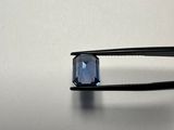 a pair of tongs with a blue stone on it