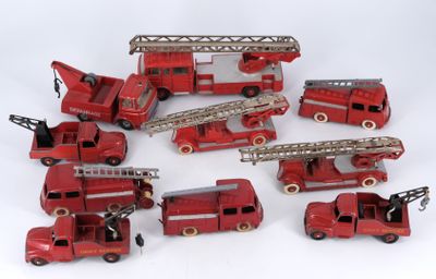 a lot of toy firetrucks sitting on a white surface