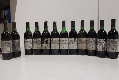 several bottles of wine are lined up on a table