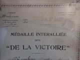 a sign on the wall that says medaille interallee ete de la victorire