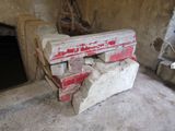a bench made out of concrete blocks in a room