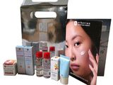 a picture of a box of skin care products with a woman ' s face