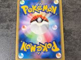 a close up of a pokemon card on a table