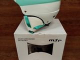 a helmet on top of a box on a table