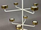 an image of a white and gold candelier with candles on it