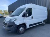 a white van parked in front of a building