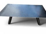 a close up of a metal table on a white background