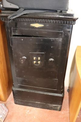 a black stove with a tv on top of it