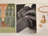 two pages of jewelry are spread out on a white surface