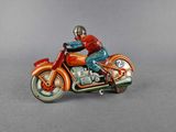 a figurine of a man riding a motorcycle