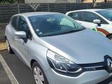 a silver car parked in a parking lot next to other cars