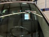 a reflection of a car in the window of a car