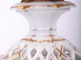 a close up of a vase on a table